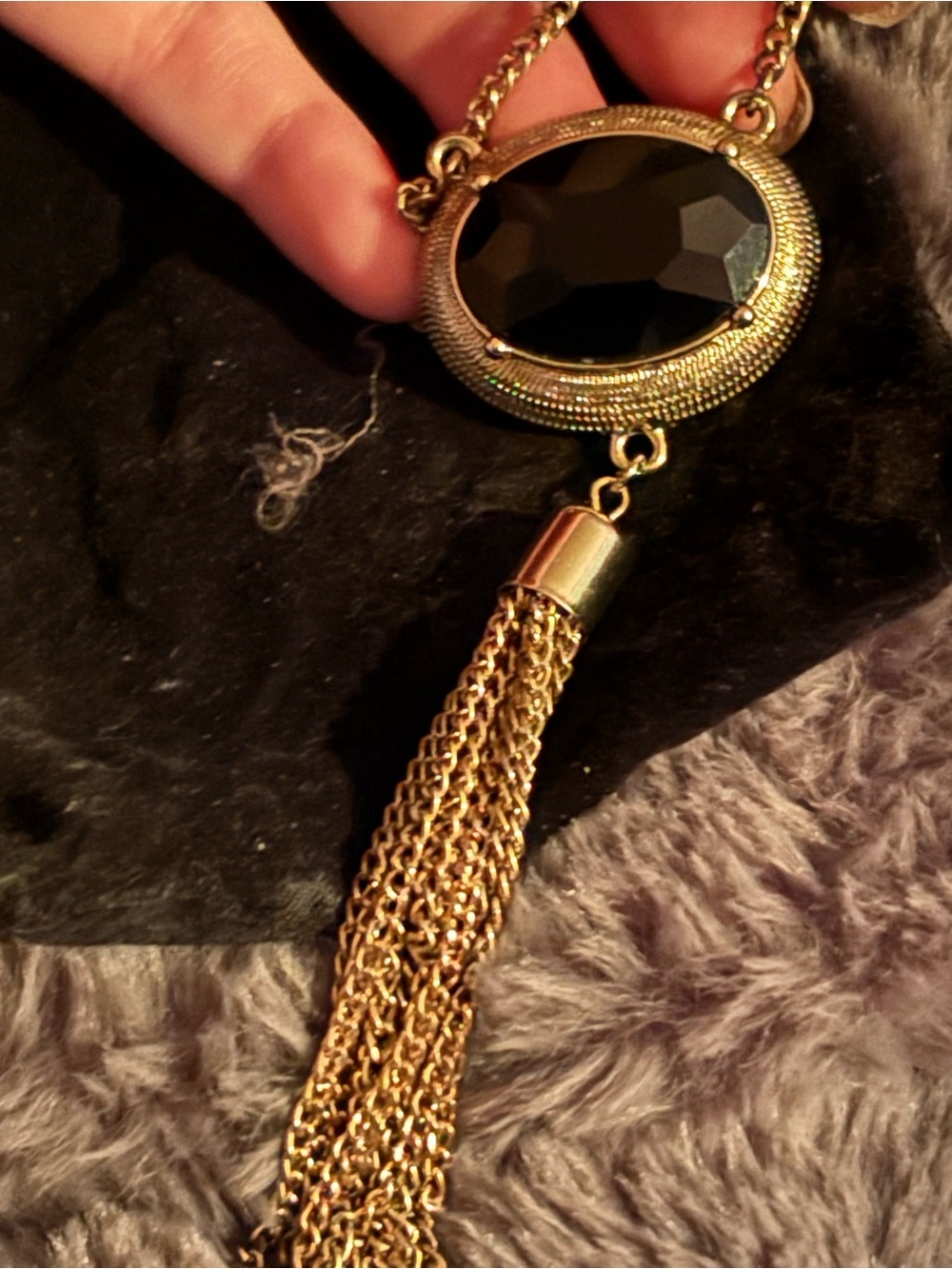 Gold-Tone Necklace with Black Oval Stone and Chain Tassel